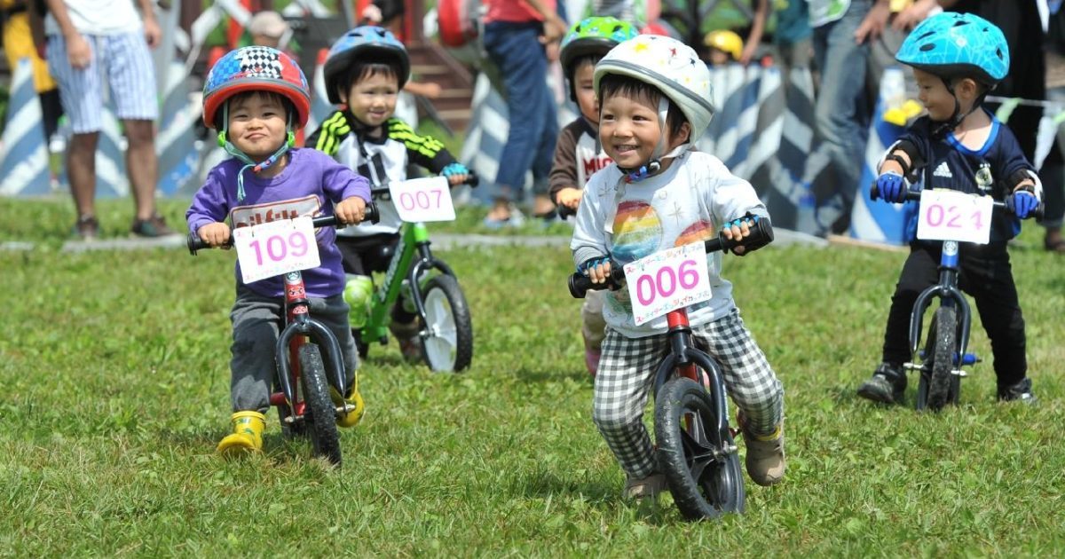 family bike riding strider park niseko summer